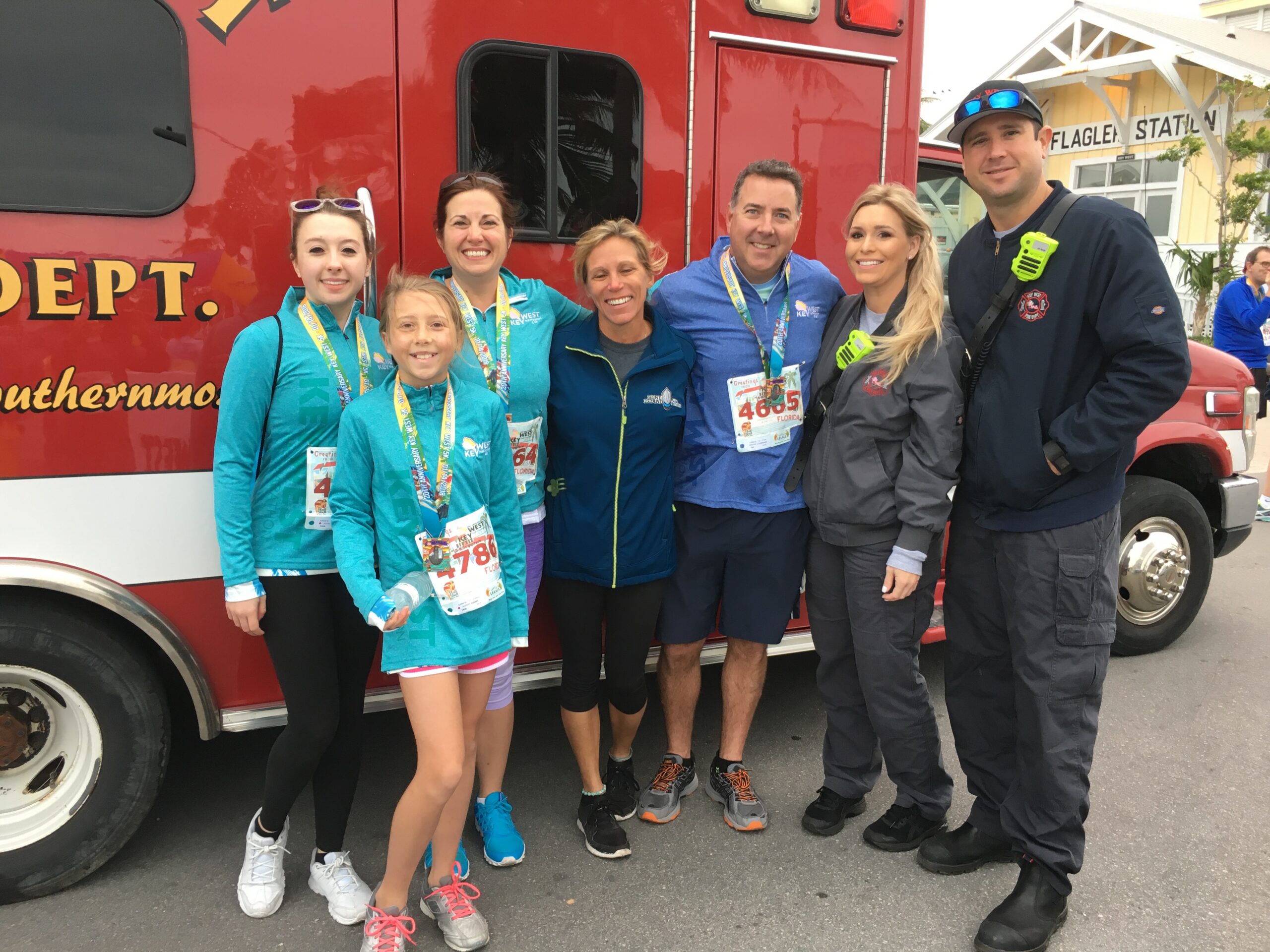 Bill Amirault and family with Key West firefighters one year after his cardiac arrest