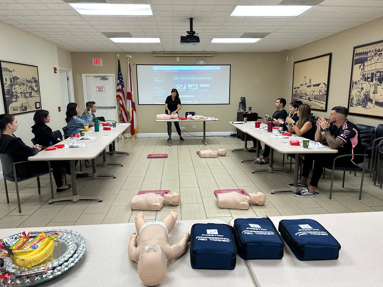 Rescue Beats CPR and AED training class with mannequins and participants